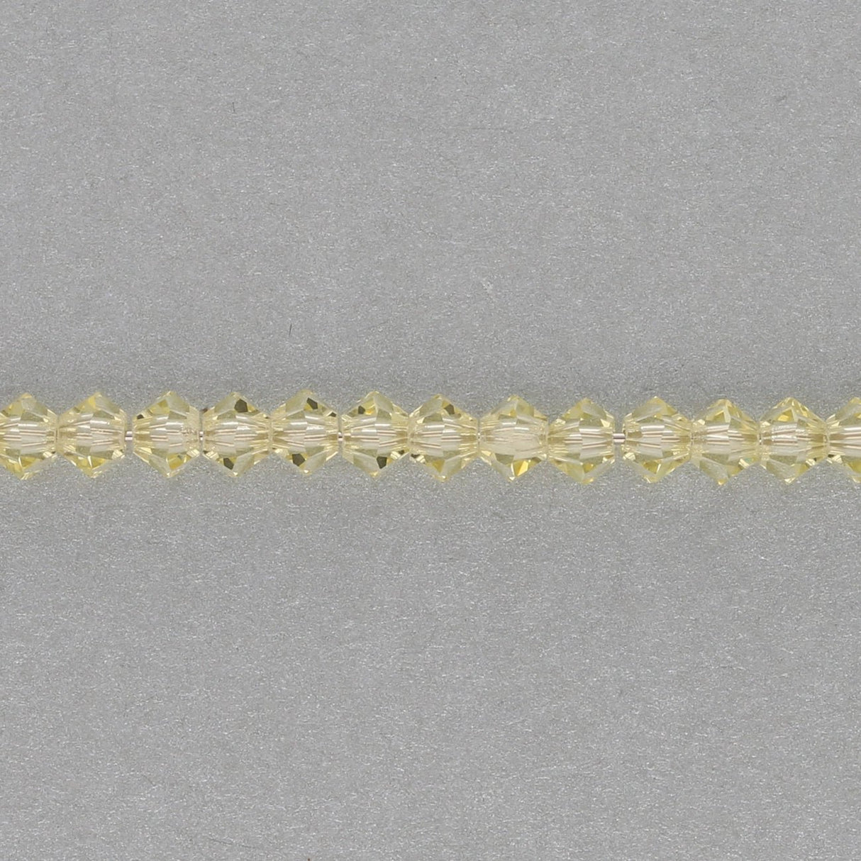 M.C. Doppelkegel 3 mm - Jonquil - PerlineBeads SA