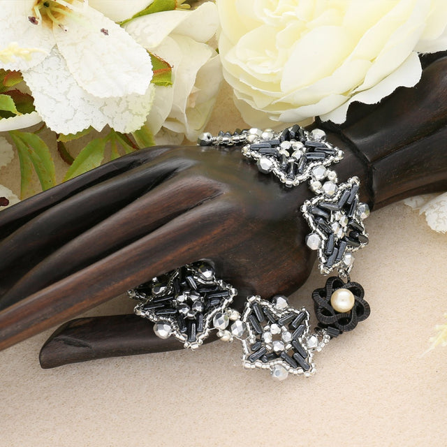 Federverschluss Blumenform – schwarz - PerlineBeads