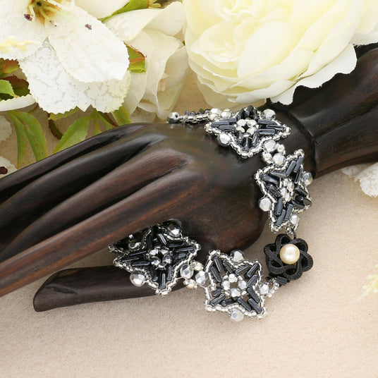 Federverschluss Blumenform – schwarz - PerlineBeads