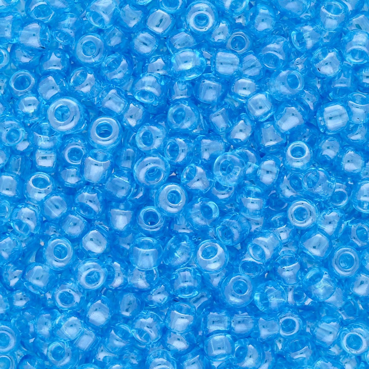 Rocailles Glasperlen 3 mm unregelmässige Grösse – Transparent Lustered Deep Sky - PerlineBeads