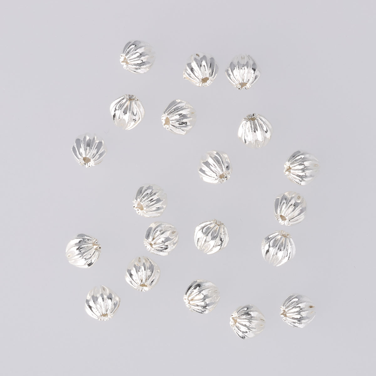 Perlina rotonda ondulata in metallo ∅ ca. 4 mm - argentato (20 pezzi)