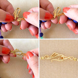 Dekorativer S - Haken Verschluss – goldfarben - PerlineBeads SA