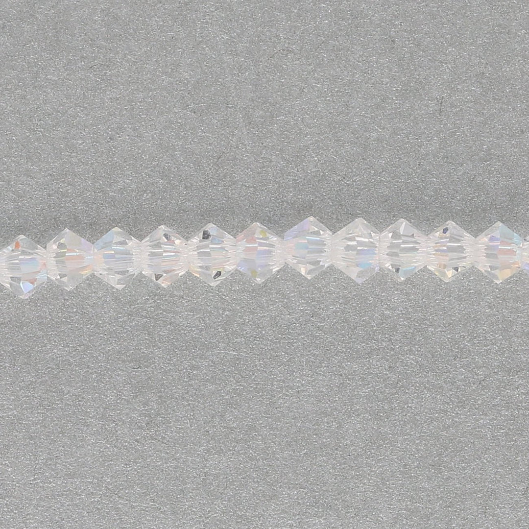 M.C. Doppelkegel 3 mm - Crystal AB - PerlineBeads SA