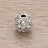 Runde Metallperle 10 mm rhodiniert mit 15 Swarovski® Kristalle - PerlineBeads SA