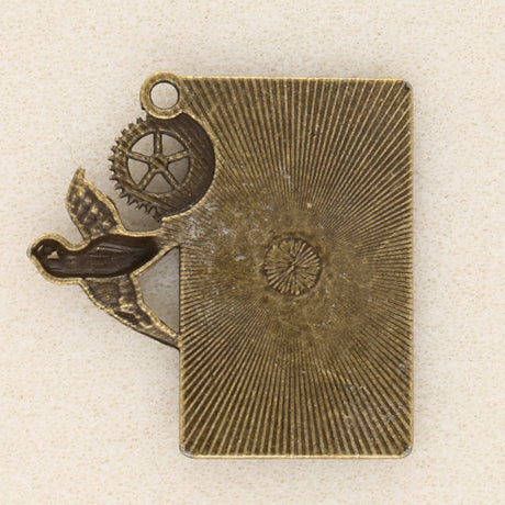 Anhänger Steampunk «Uhr und Schwalbe» - Bronze antik - PerlineBeads