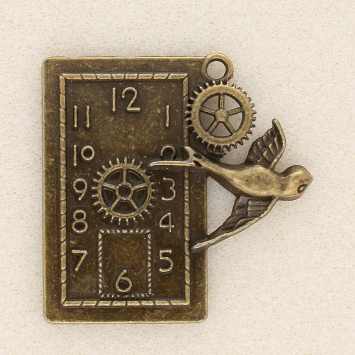 Anhänger Steampunk «Uhr und Schwalbe» - Bronze antik - PerlineBeads