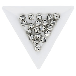 Metallperle im tibetischen Stil 8 x 6,5 mm - Antiksilber - PerlineBeads