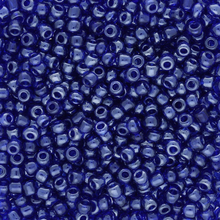 Rocailles Glasperlen 3 mm unregelmässige Grösse – Transparent Lustered Blue - PerlineBeads