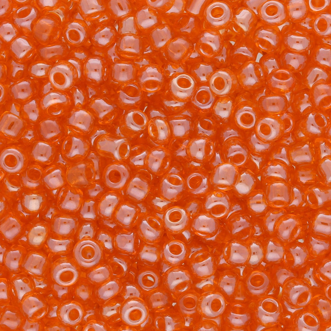 Rocailles Glasperlen 3 mm unregelmässige Grösse – Transparent Lustered Coral - PerlineBeads
