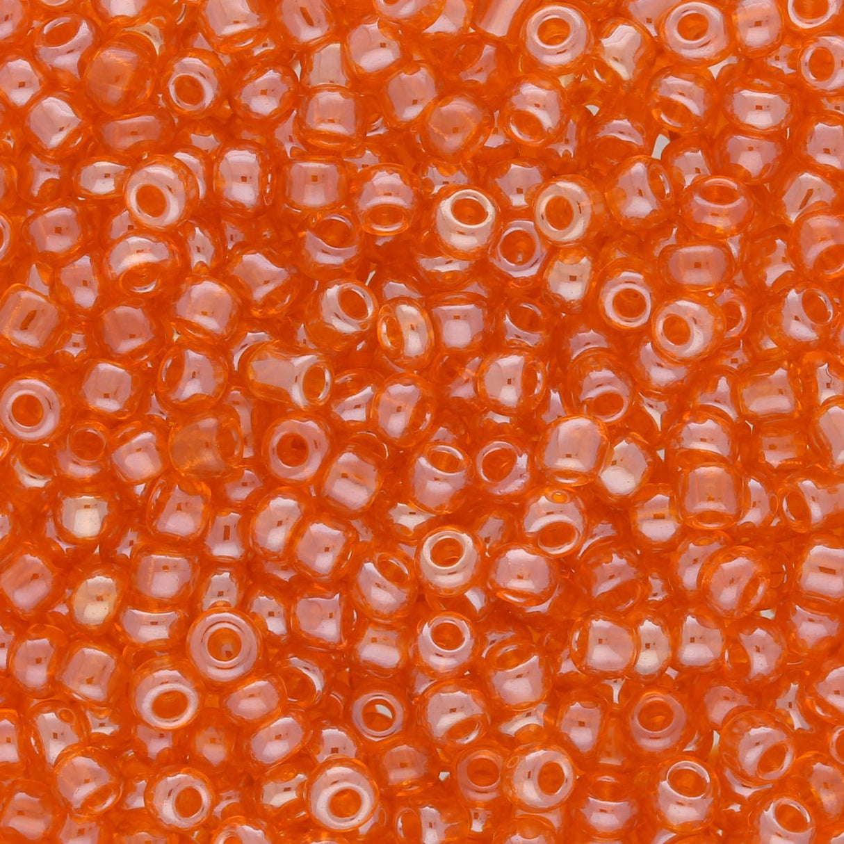 Rocailles Glasperlen 3 mm unregelmässige Grösse – Transparent Lustered Coral - PerlineBeads