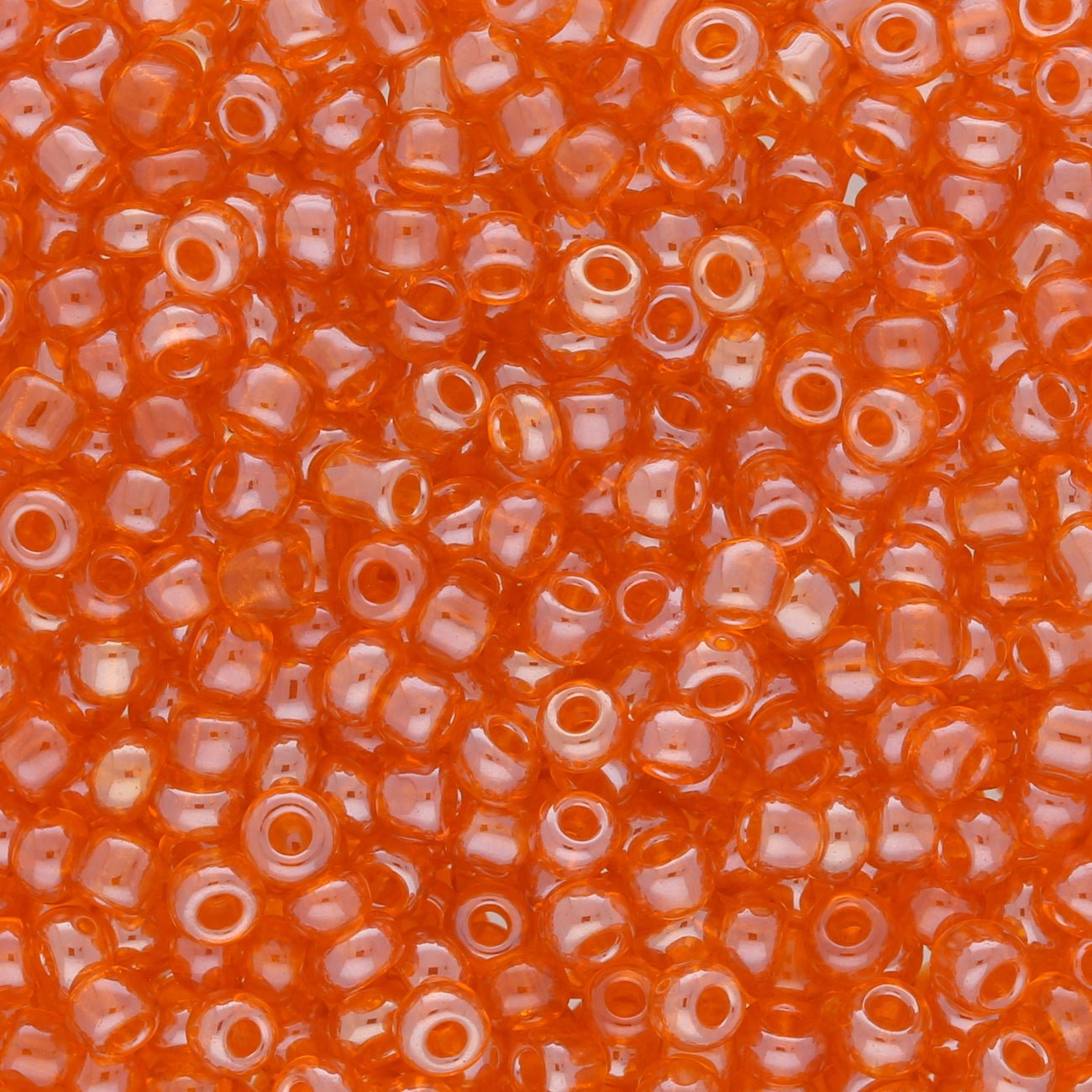 Rocailles Glasperlen 3 mm unregelmässige Grösse – Transparent Lustered Coral - PerlineBeads