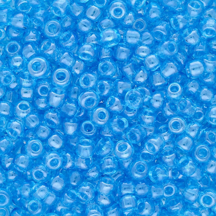 Rocailles Glasperlen 3 mm unregelmässige Grösse – Transparent Lustered Deep Sky - PerlineBeads