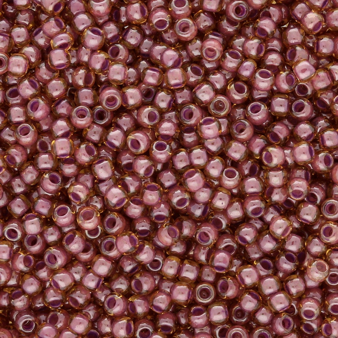 Rocailles-Perlen Toho 11/0 – Inside color Light Topaz/Pink-Lined - PerlineBeads