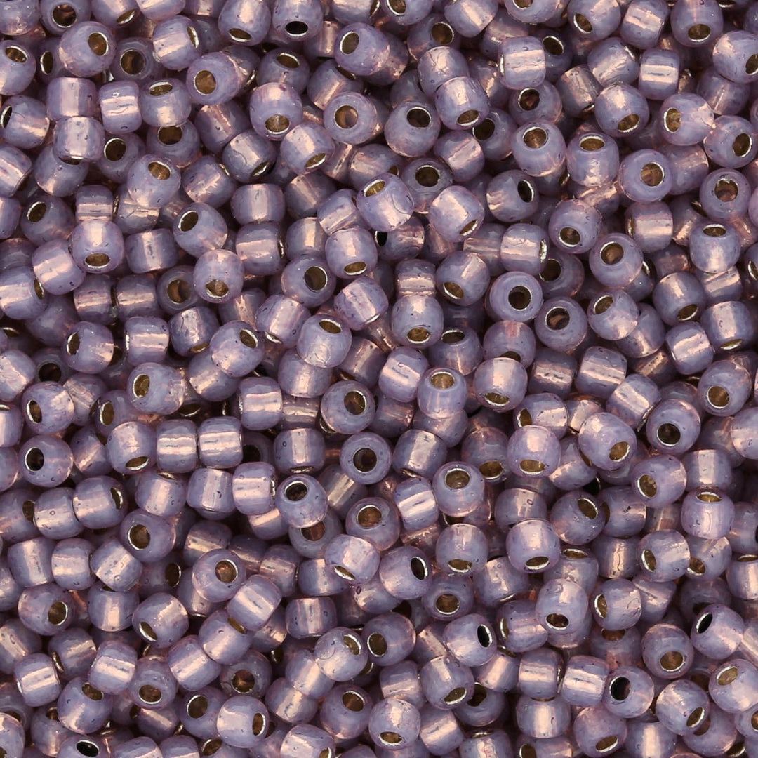 Rocailles-Perlen Toho 11/0 – PermaFinish Silver-Lined Milky Amethyst - PerlineBeads