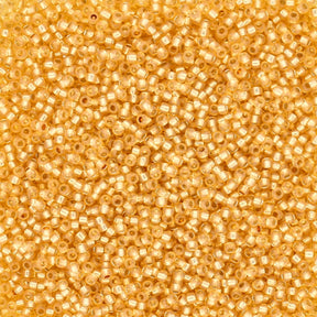 Rocailles-Perlen Toho 15/0 – Silver-Lined Milky Light Topaz - PerlineBeads